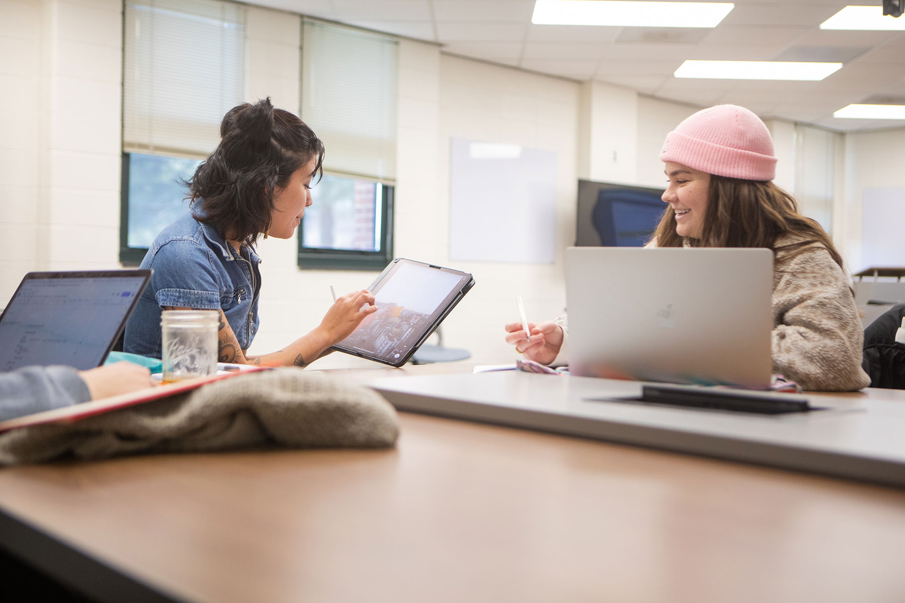 Two students talking in classroom