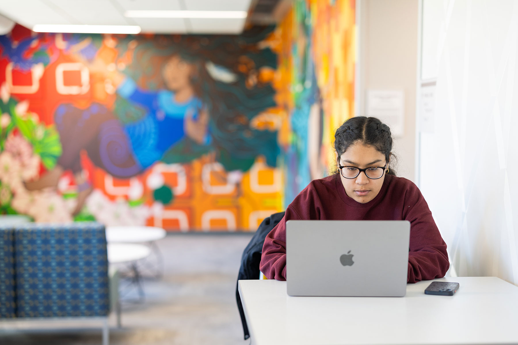 Studying scene of student working at laptop